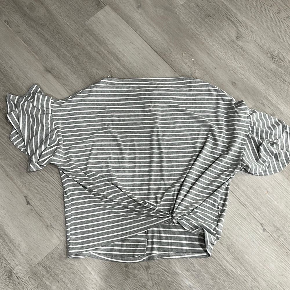 UMGEE quarter ruffle sleeve knotted front blouse.